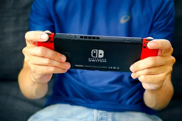 Depositphotos 278926132 Stock Photo Man Playing Nintendo Switch Video